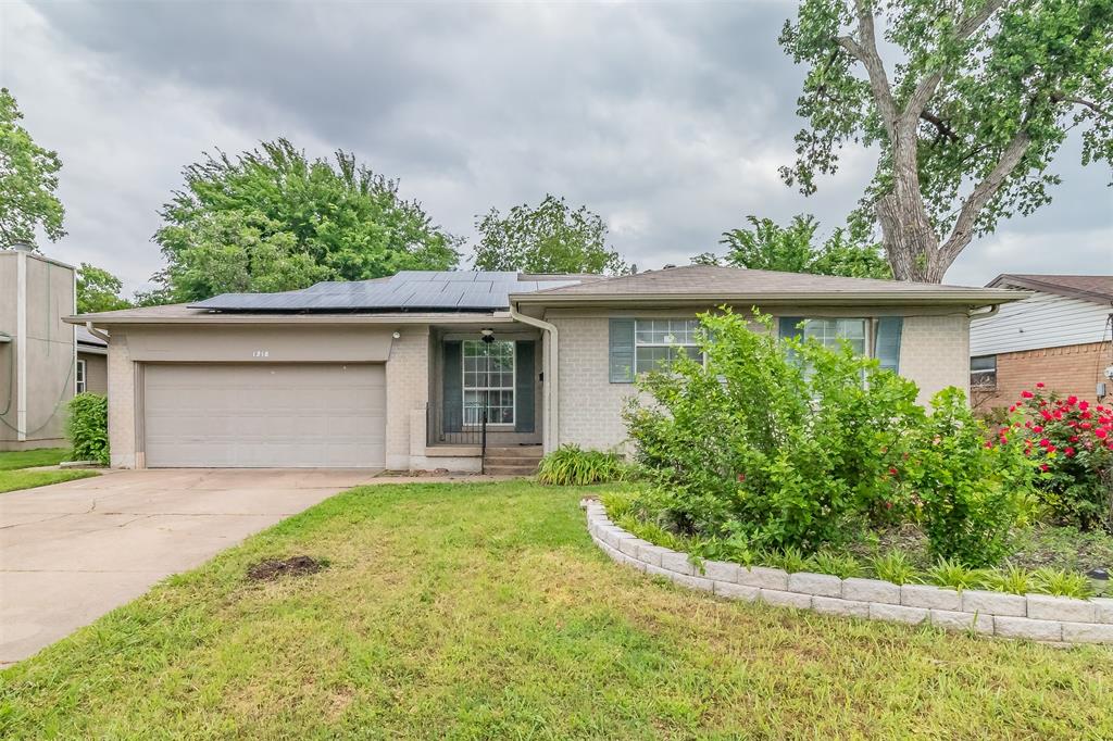 1318 North Rogers Road Irving, TX 75061 - Photo 1 of 1 front view of a house with a yard