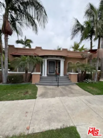 a backyard of a house with outdoor seating