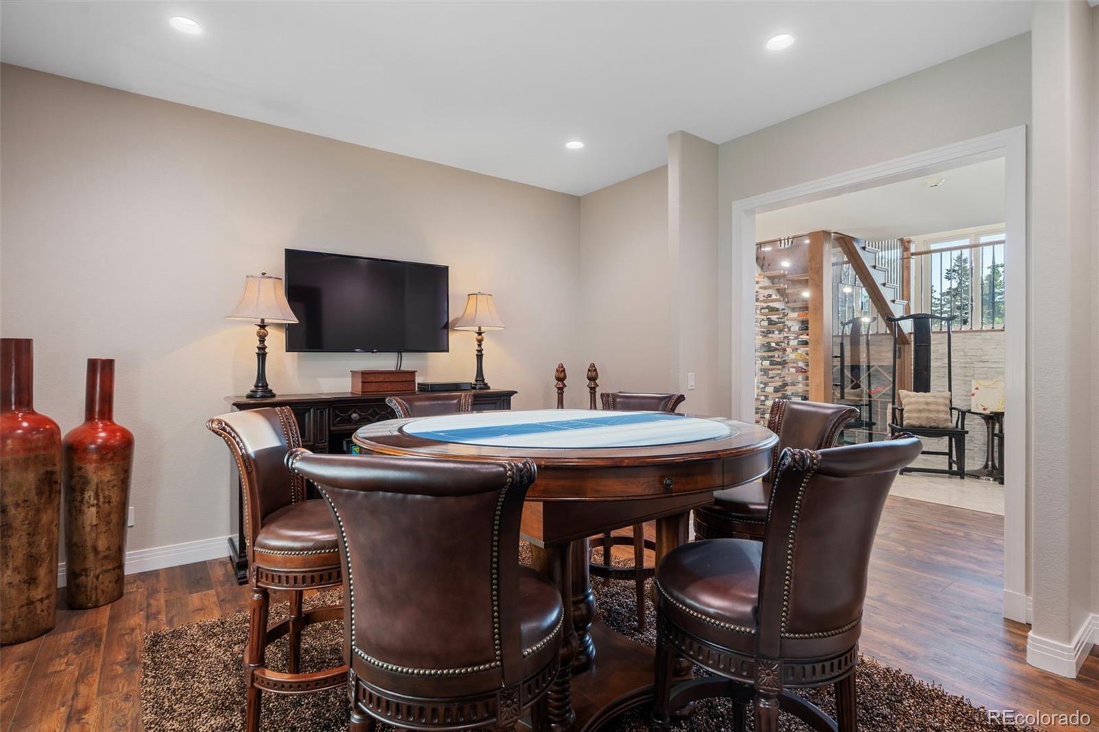 730 Genesee Mountain Road Golden, CO 80401 - Photo 31 of 50 a dining room with furniture and wooden floor