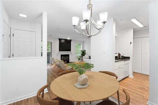 a kitchen with a table and chairs in it