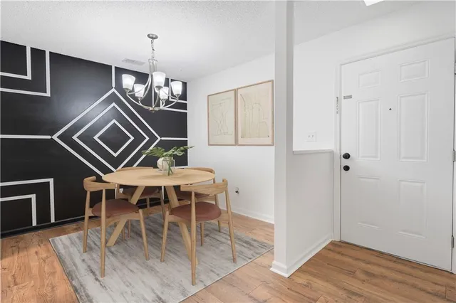a view of a livingroom with furniture and wooden floor