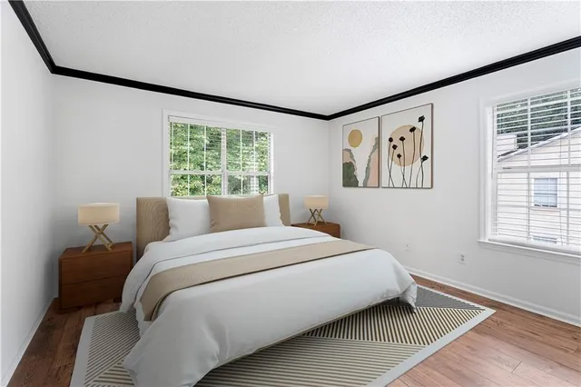 a bedroom with a large bed and a window