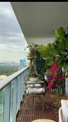 a kitchen with stainless steel appliances kitchen island granite countertop a table and chairs in it