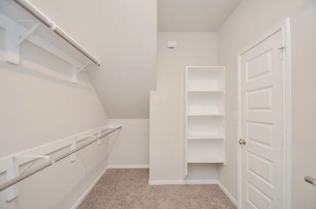 a view of an empty walk in closet