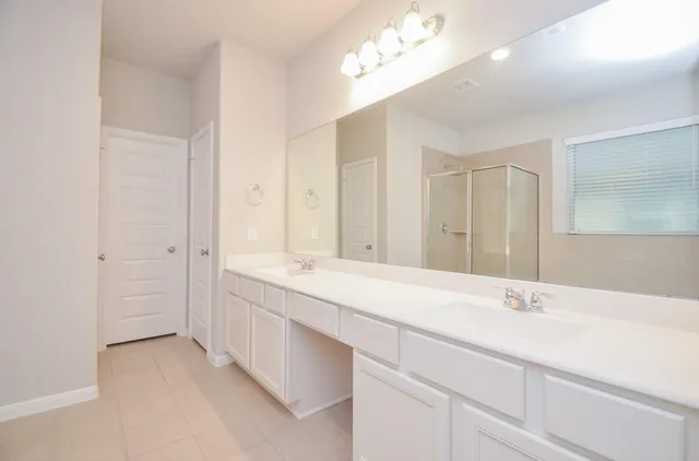 a bathroom with a sink a vanity and a mirror