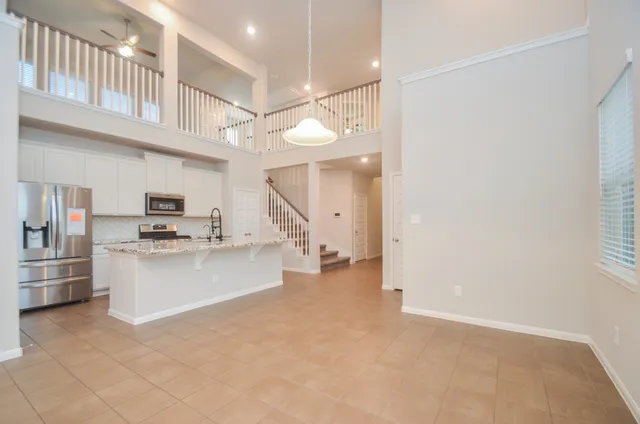 a view of a kitchen with furniture and a kitchen