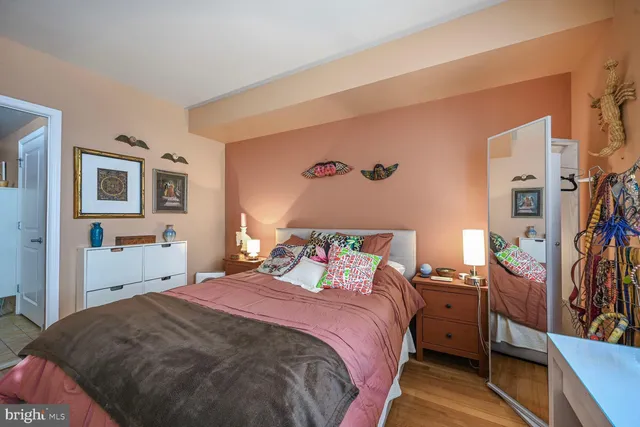 a bedroom with a bed and a tv