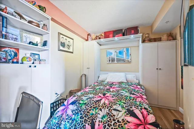 a bedroom with a bed and a dresser