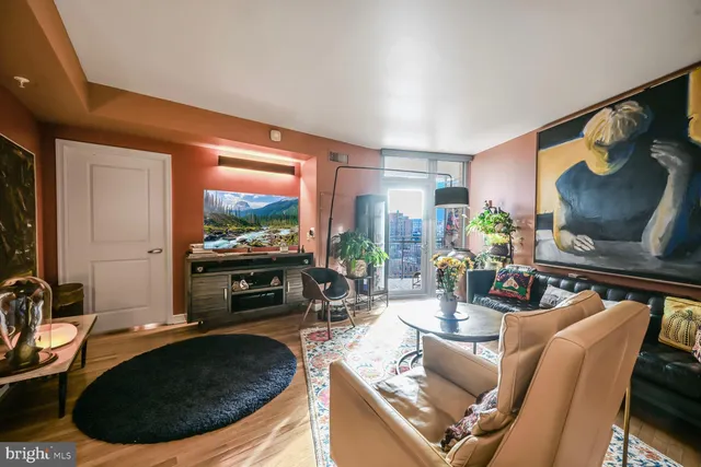 a room with furniture and a flat screen tv