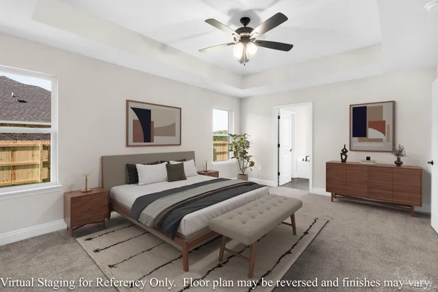 a spacious bedroom with a bed a couch and a window