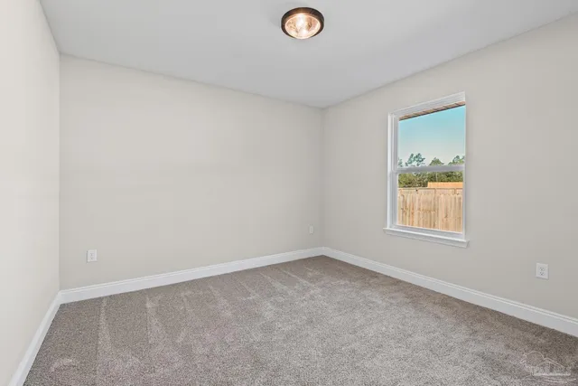 a view of room with window and ceiling fan