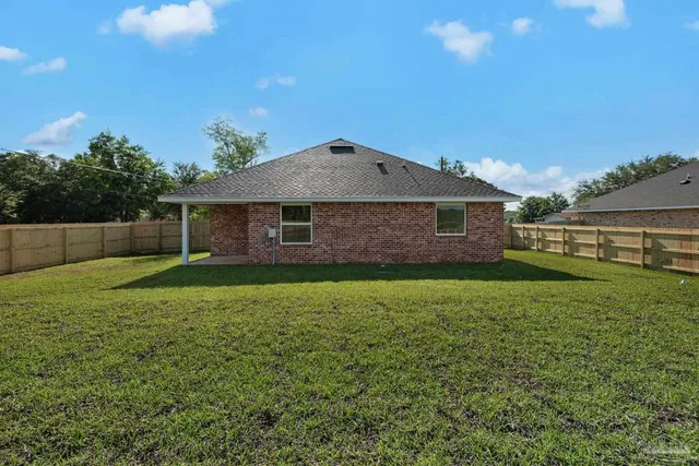 a view of a lake with houses in the background