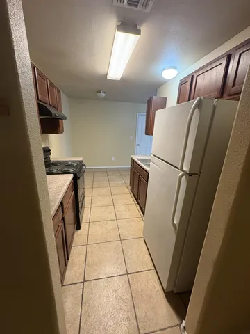 a utility room with cabinets washer and dryer