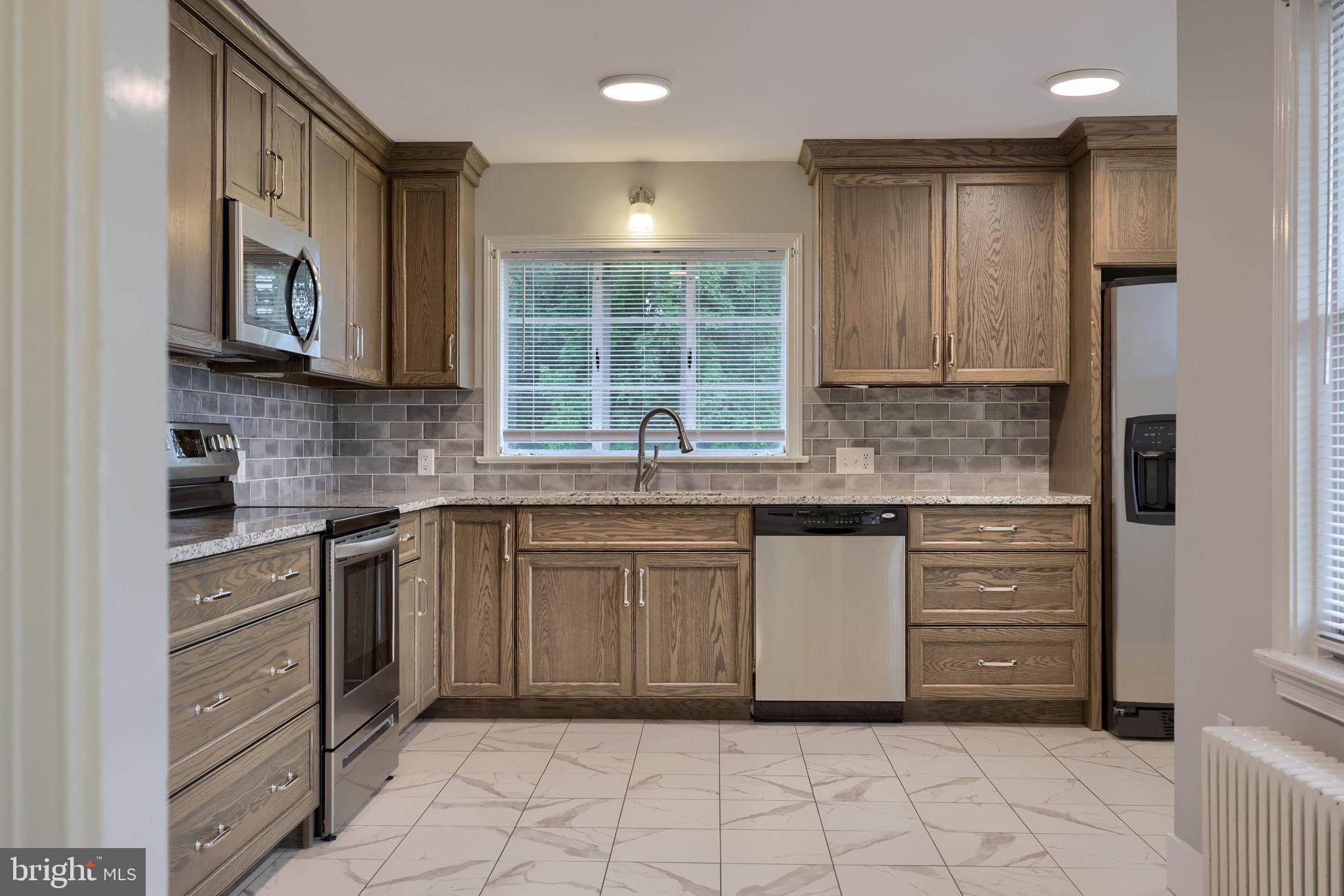 145 Weaver Road Lancaster, PA 17603 - Photo 25 of 87 a kitchen with cabinets appliances and a window
