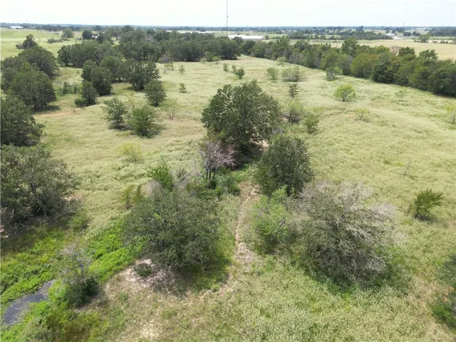 a view of lake with green space