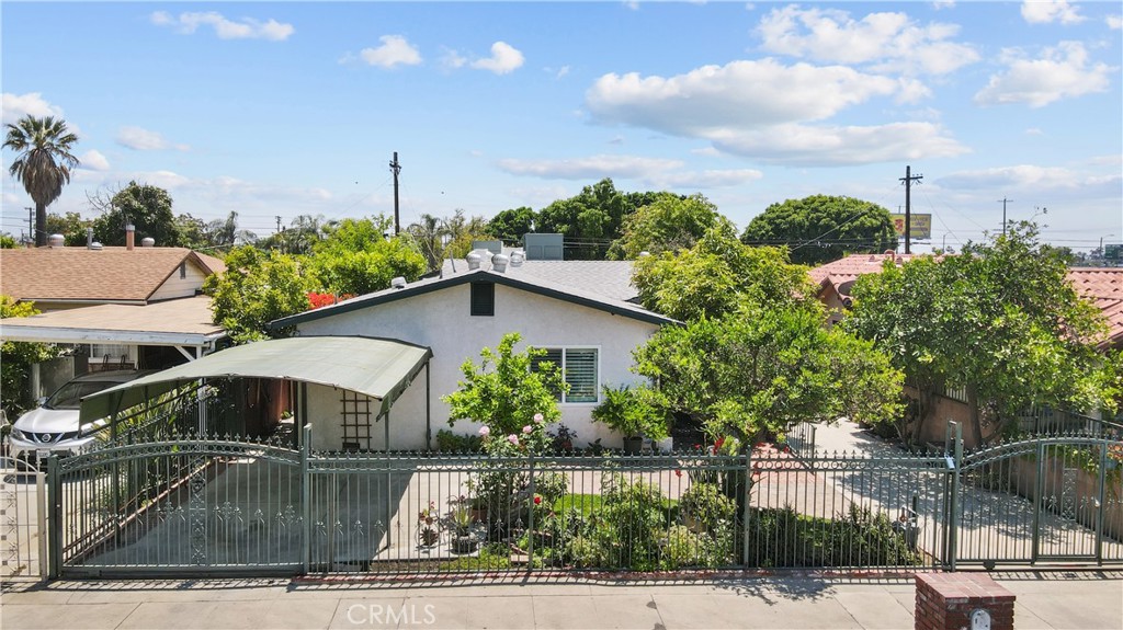 a view of a house with a yard and sitting area