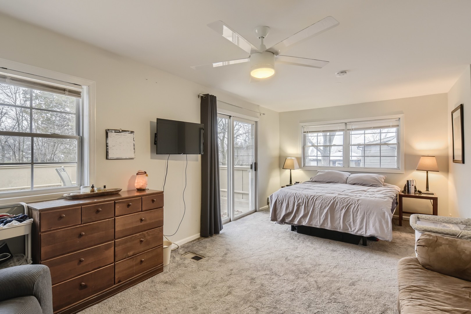 19420 Wolf Road Mokena, IL 60448 - Photo 17 of 32 a spacious bedroom with a bed and a dresser