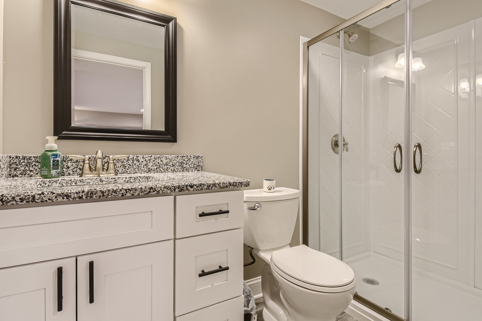 19420 Wolf Road Mokena, IL 60448 - Photo 25 of 32 a bathroom with a granite countertop toilet sink and mirror