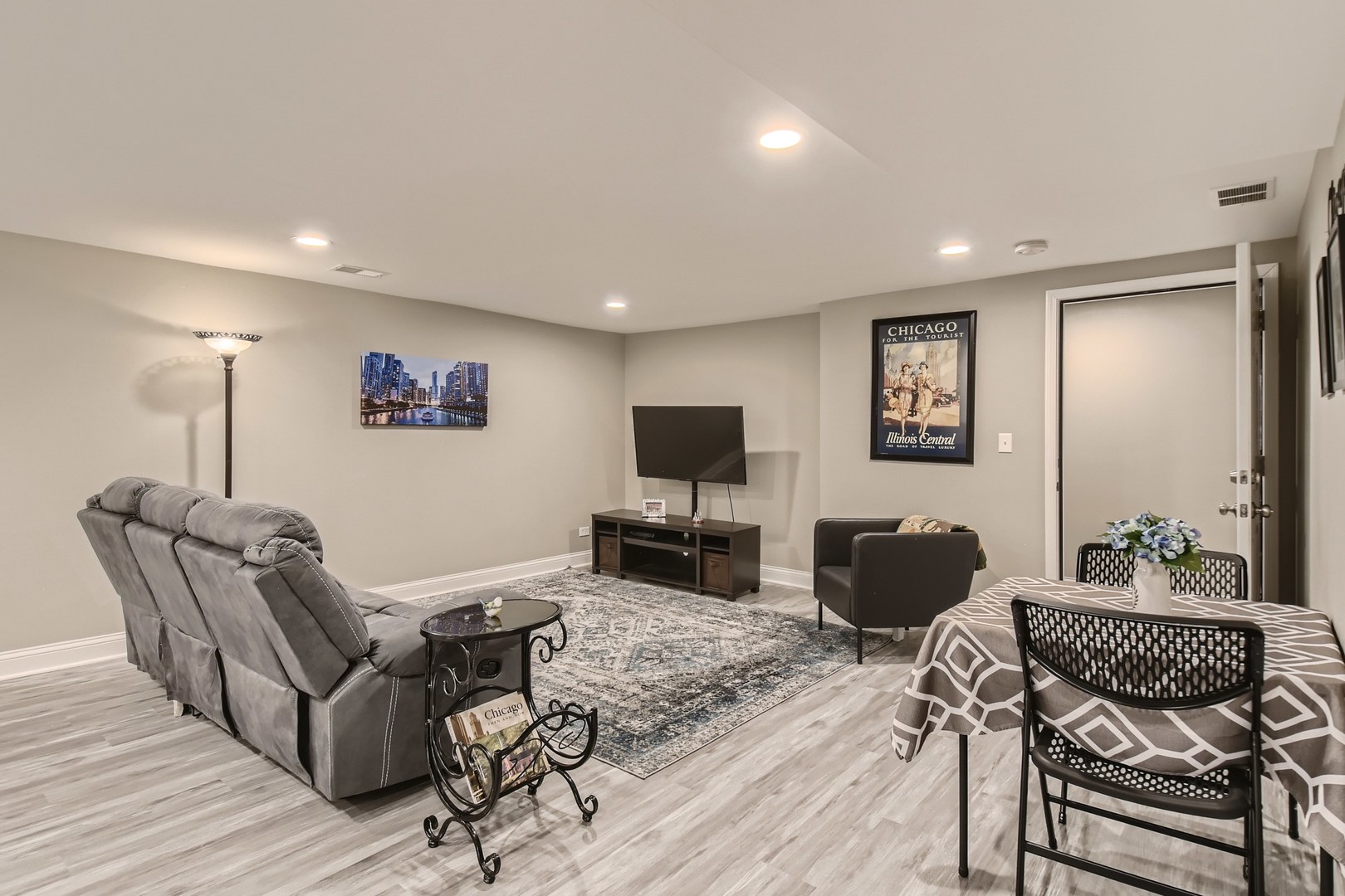 19420 Wolf Road Mokena, IL 60448 - Photo 26 of 32 a living room with furniture or wooden floor and a flat screen tv
