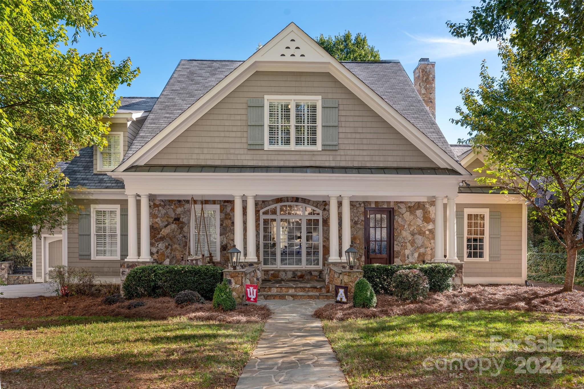 8432 Highgrove Street Charlotte, NC 28277 - Photo 1 of 46 a front view of a house with a yard
