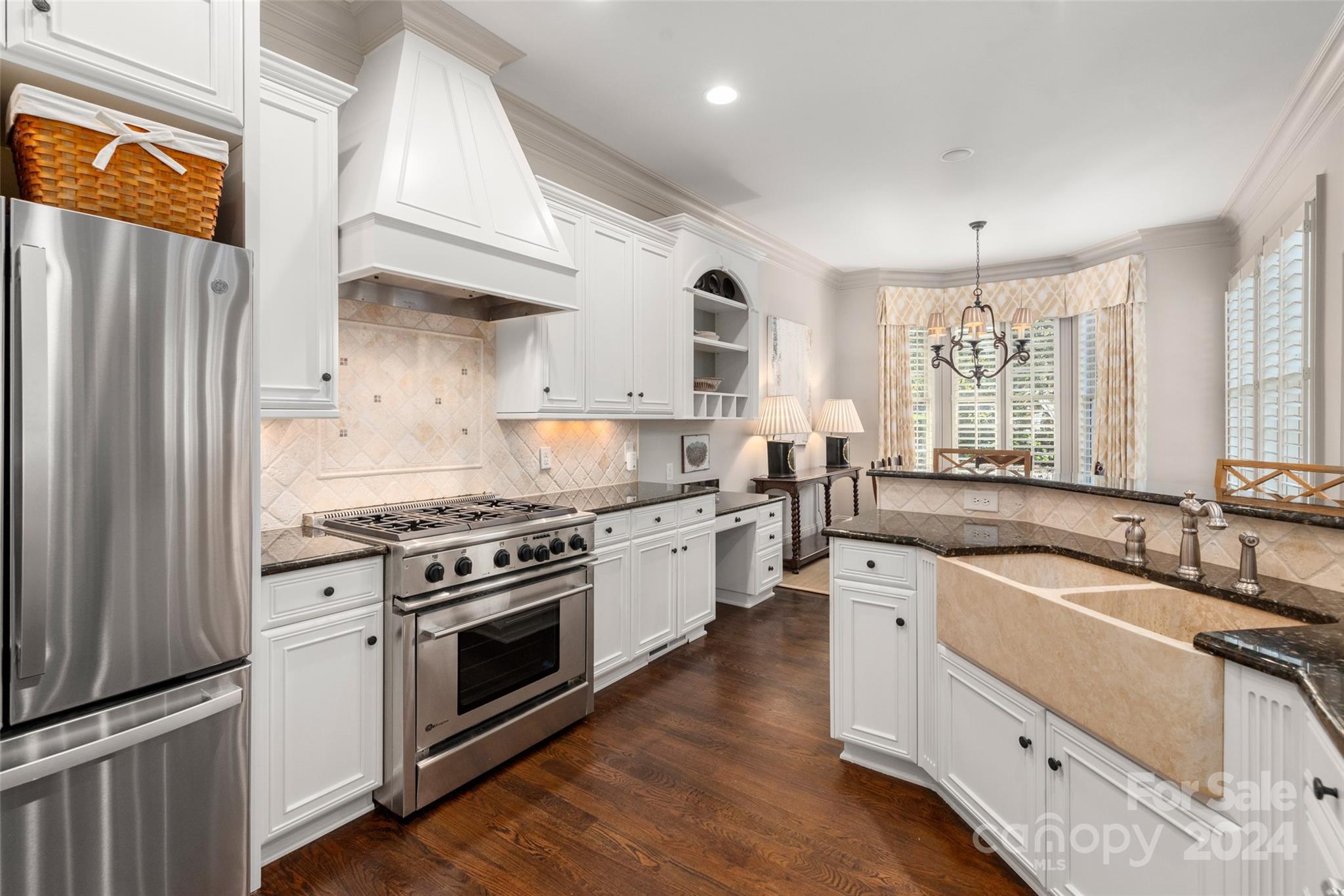 8432 Highgrove Street Charlotte, NC 28277 - Photo 13 of 46 a kitchen with stainless steel appliances granite countertop a sink stove and refrigerator