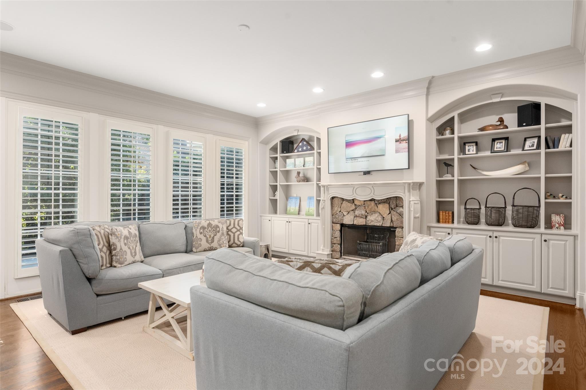 8432 Highgrove Street Charlotte, NC 28277 - Photo 18 of 46 a living room with furniture and a fireplace