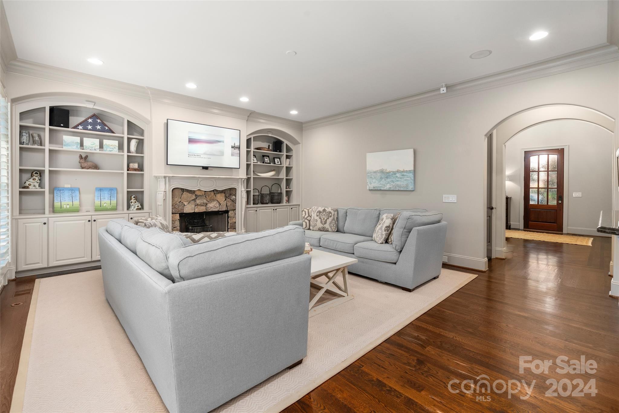 8432 Highgrove Street Charlotte, NC 28277 - Photo 19 of 46 a living room with furniture and a fireplace