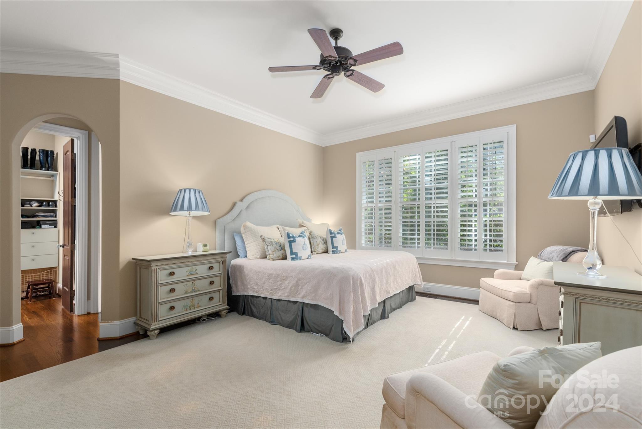 8432 Highgrove Street Charlotte, NC 28277 - Photo 24 of 46 a spacious bedroom with two beds and a chandelier