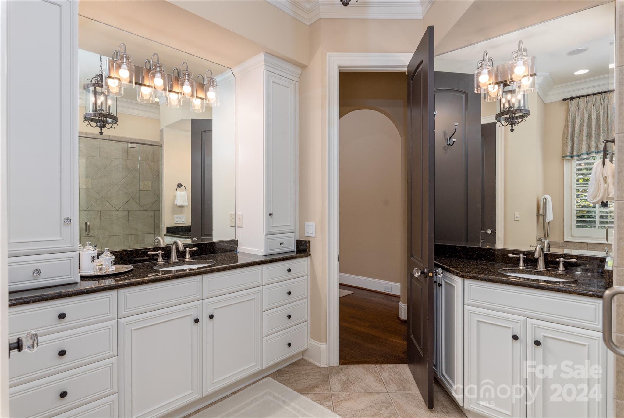 8432 Highgrove Street Charlotte, NC 28277 - Photo 25 of 46 a bathroom with double sink and a mirror