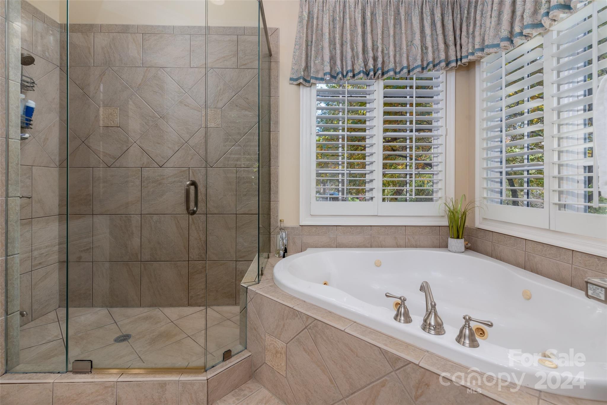 8432 Highgrove Street Charlotte, NC 28277 - Photo 26 of 46 a white bath tub sitting next to a window