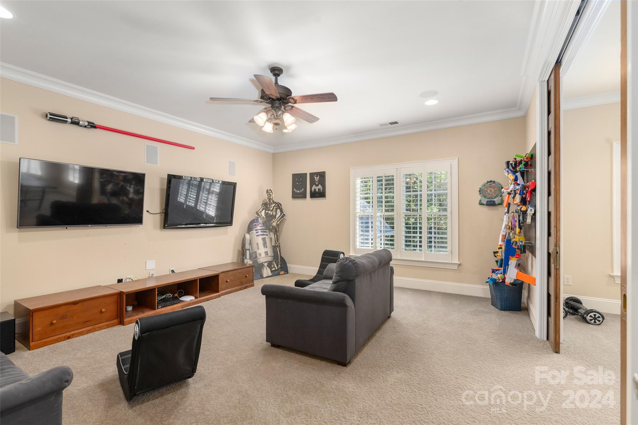 8432 Highgrove Street Charlotte, NC 28277 - Photo 30 of 46 a living room with furniture and a flat screen tv