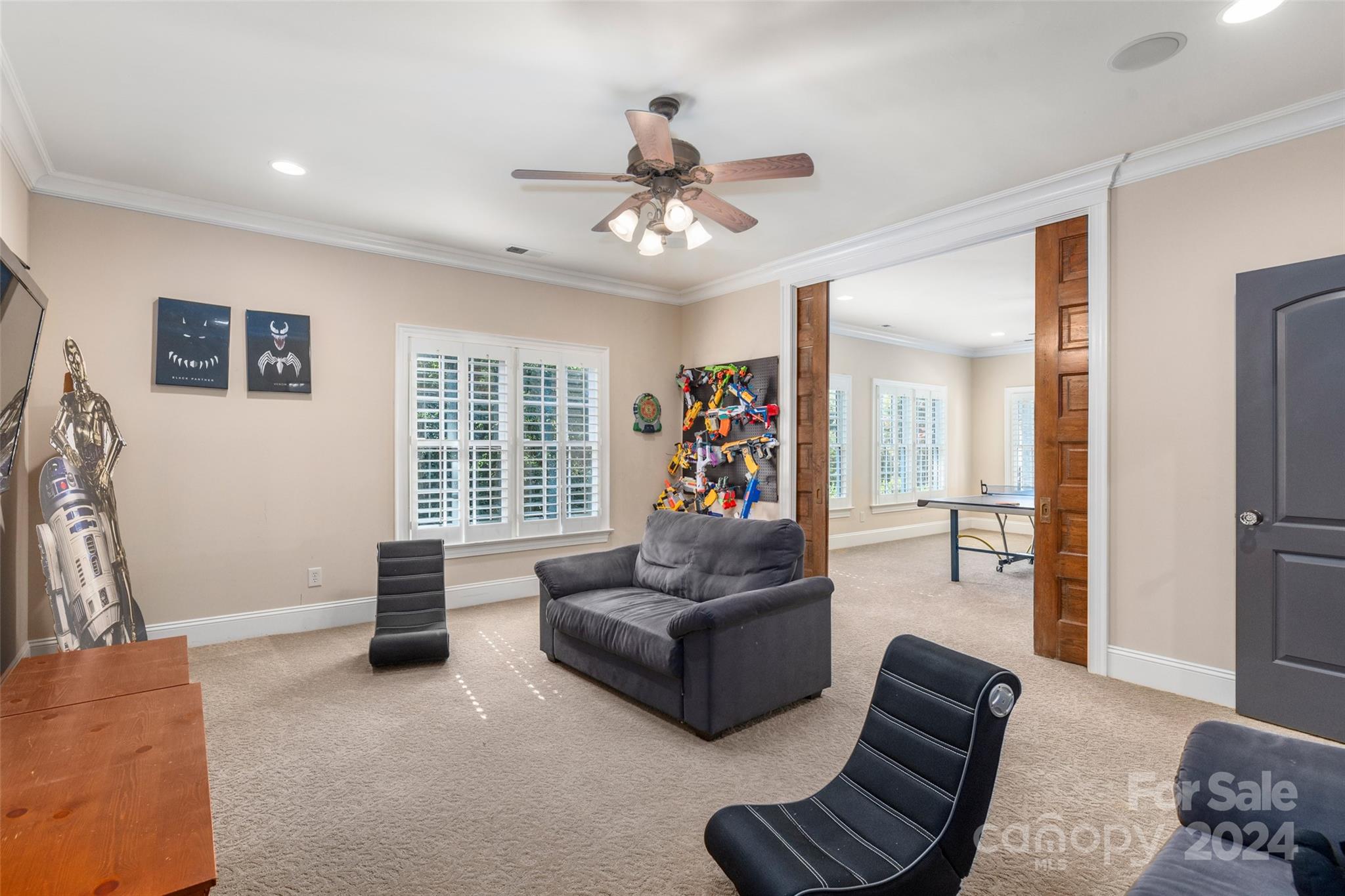 8432 Highgrove Street Charlotte, NC 28277 - Photo 31 of 46 a living room with furniture and a flat screen tv