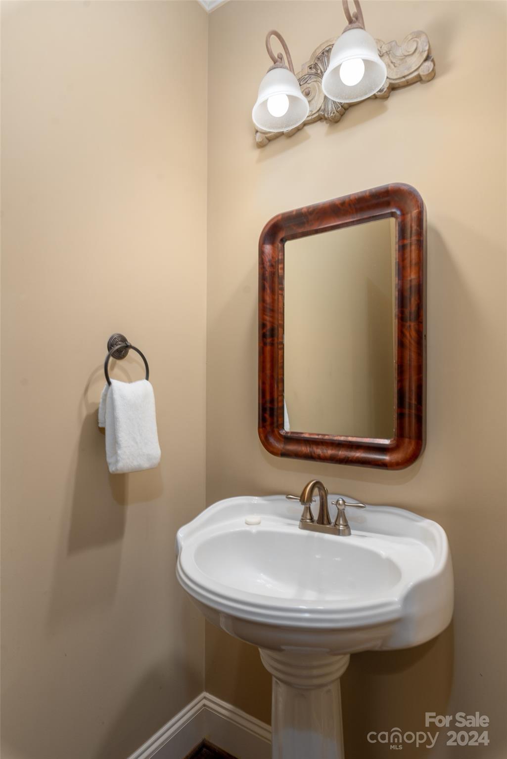 8432 Highgrove Street Charlotte, NC 28277 - Photo 32 of 46 a bathroom with a sink and mirror