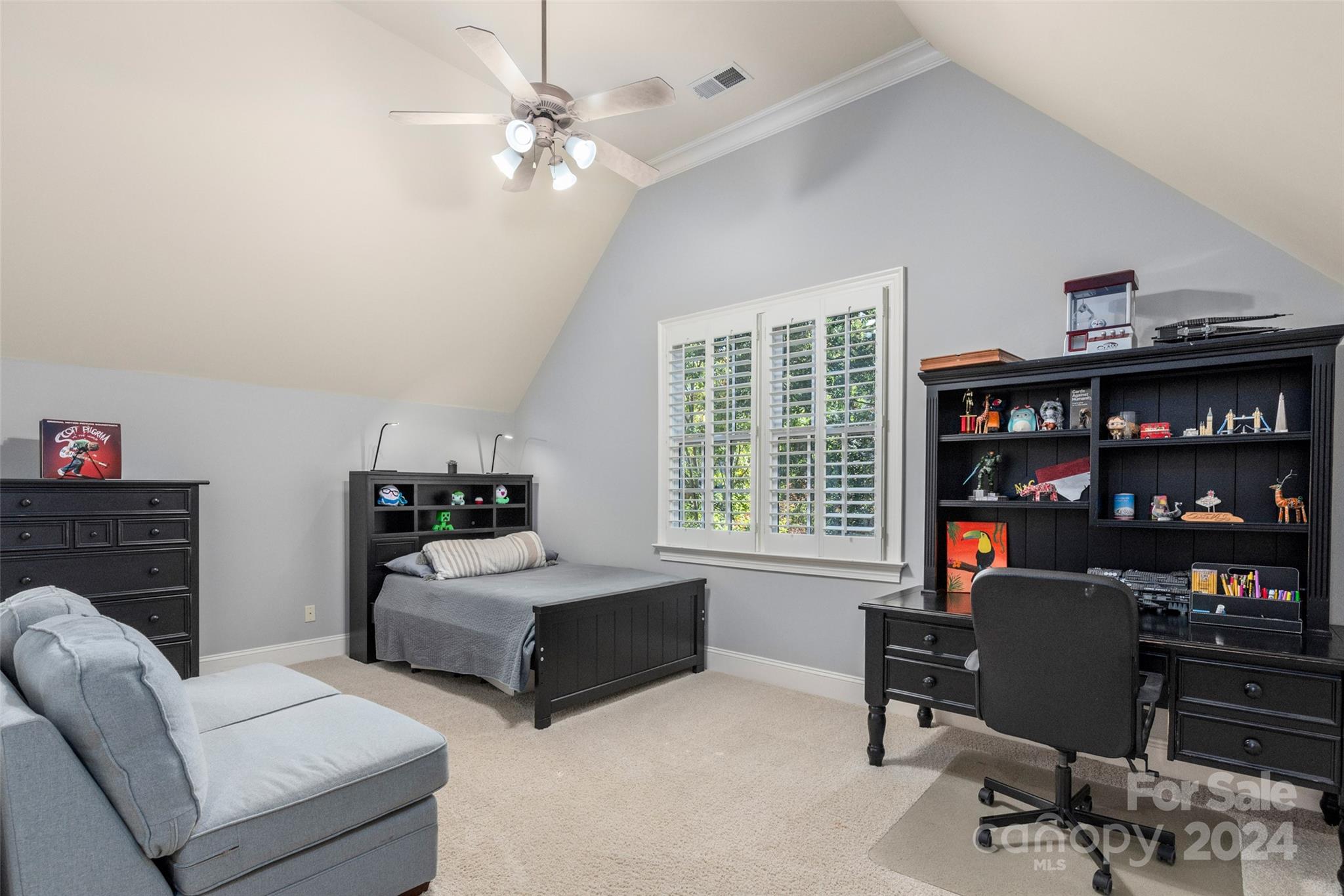 8432 Highgrove Street Charlotte, NC 28277 - Photo 37 of 46 a living room with furniture a bookshelf and a window