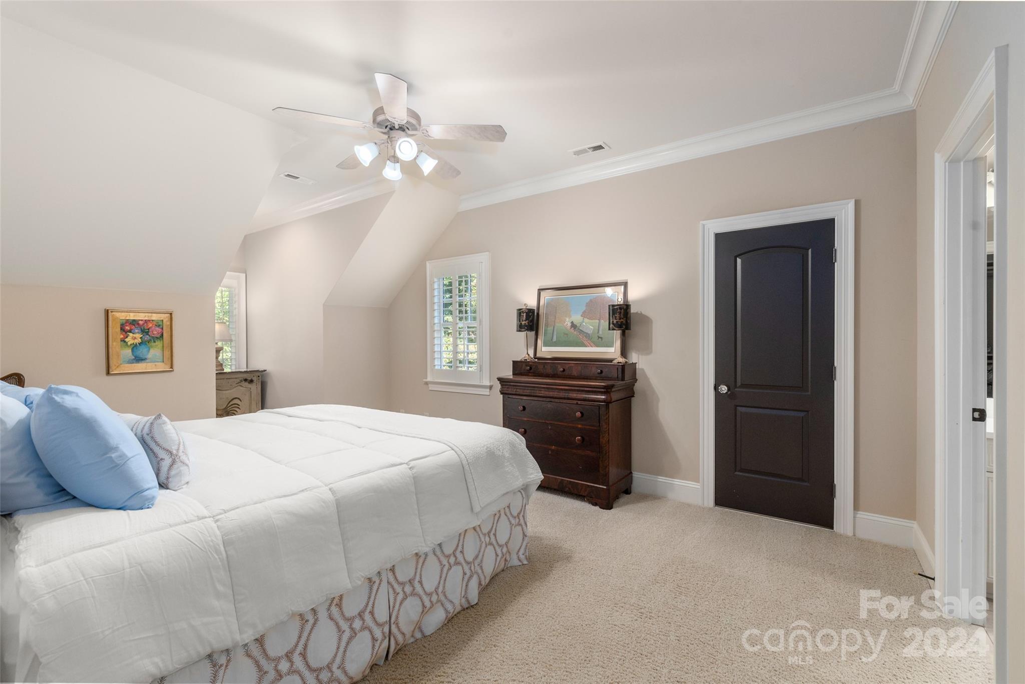 8432 Highgrove Street Charlotte, NC 28277 - Photo 39 of 46 a bedroom with a bed and a chandelier