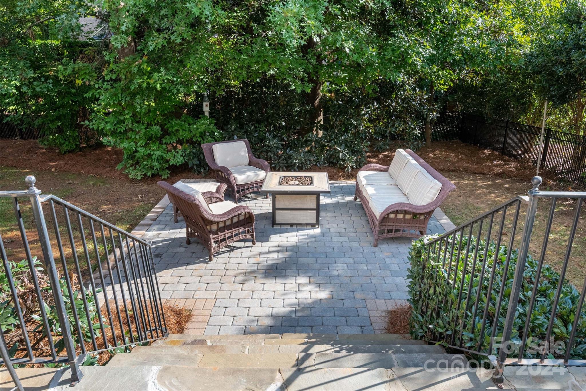 8432 Highgrove Street Charlotte, NC 28277 - Photo 42 of 46 a view of a patio with table and chairs and potted plants