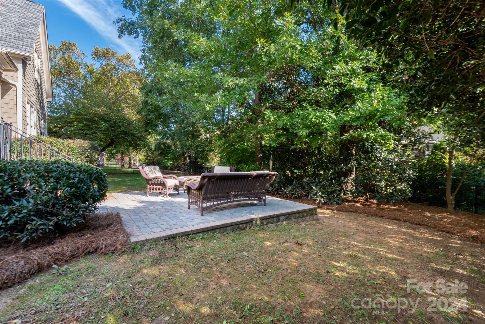 8432 Highgrove Street Charlotte, NC 28277 - Photo 43 of 46 a view of a patio with chairs and plants