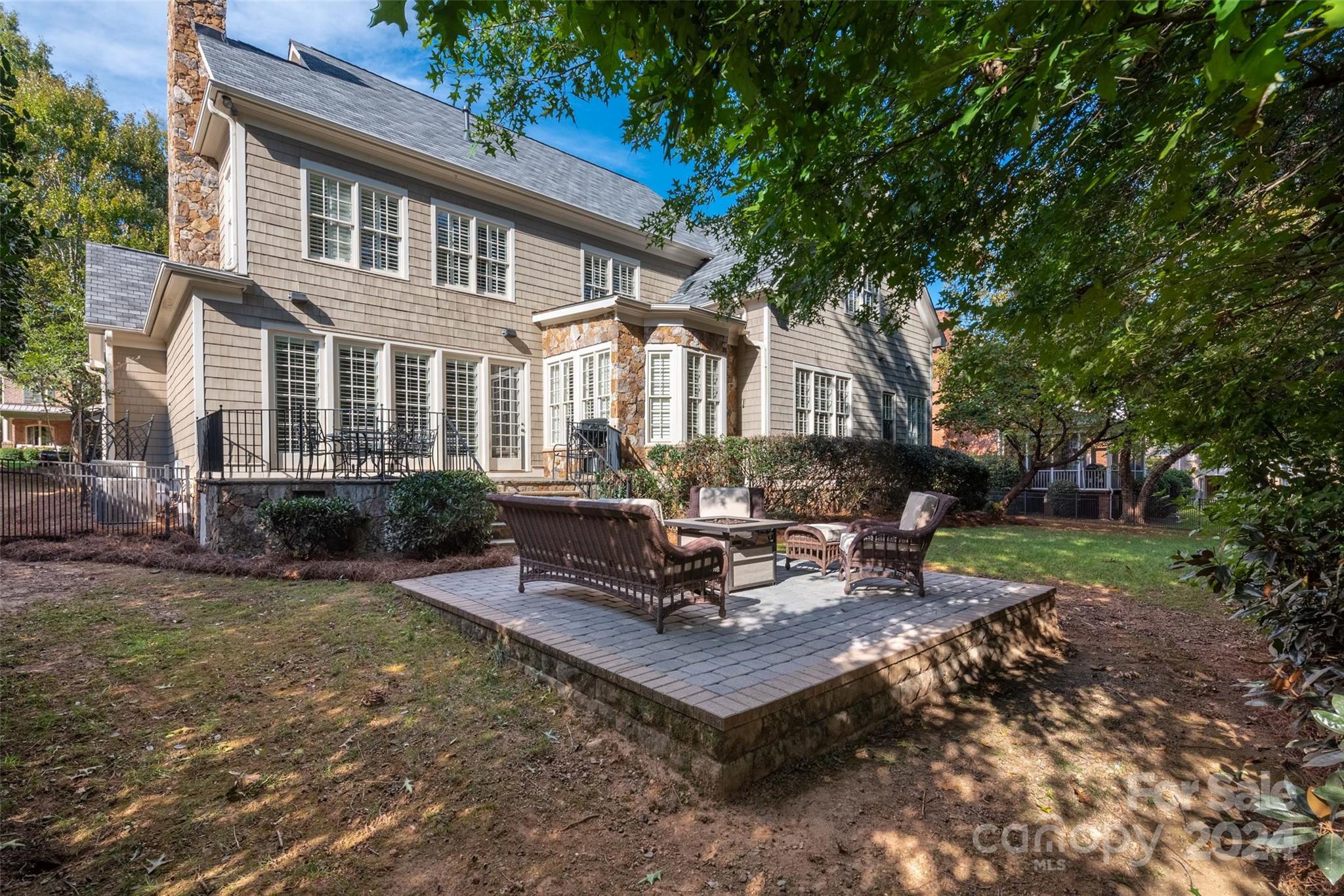 8432 Highgrove Street Charlotte, NC 28277 - Photo 45 of 46 a view of a patio with a table and chairs