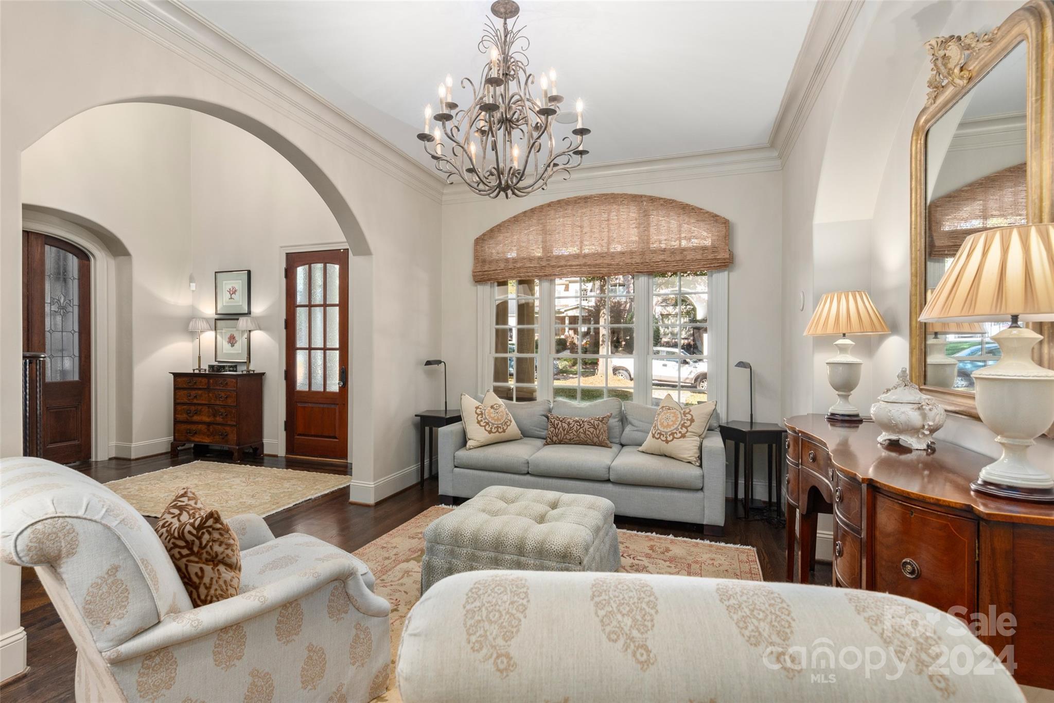 8432 Highgrove Street Charlotte, NC 28277 - Photo 10 of 46 a living room with furniture chandelier and a large window