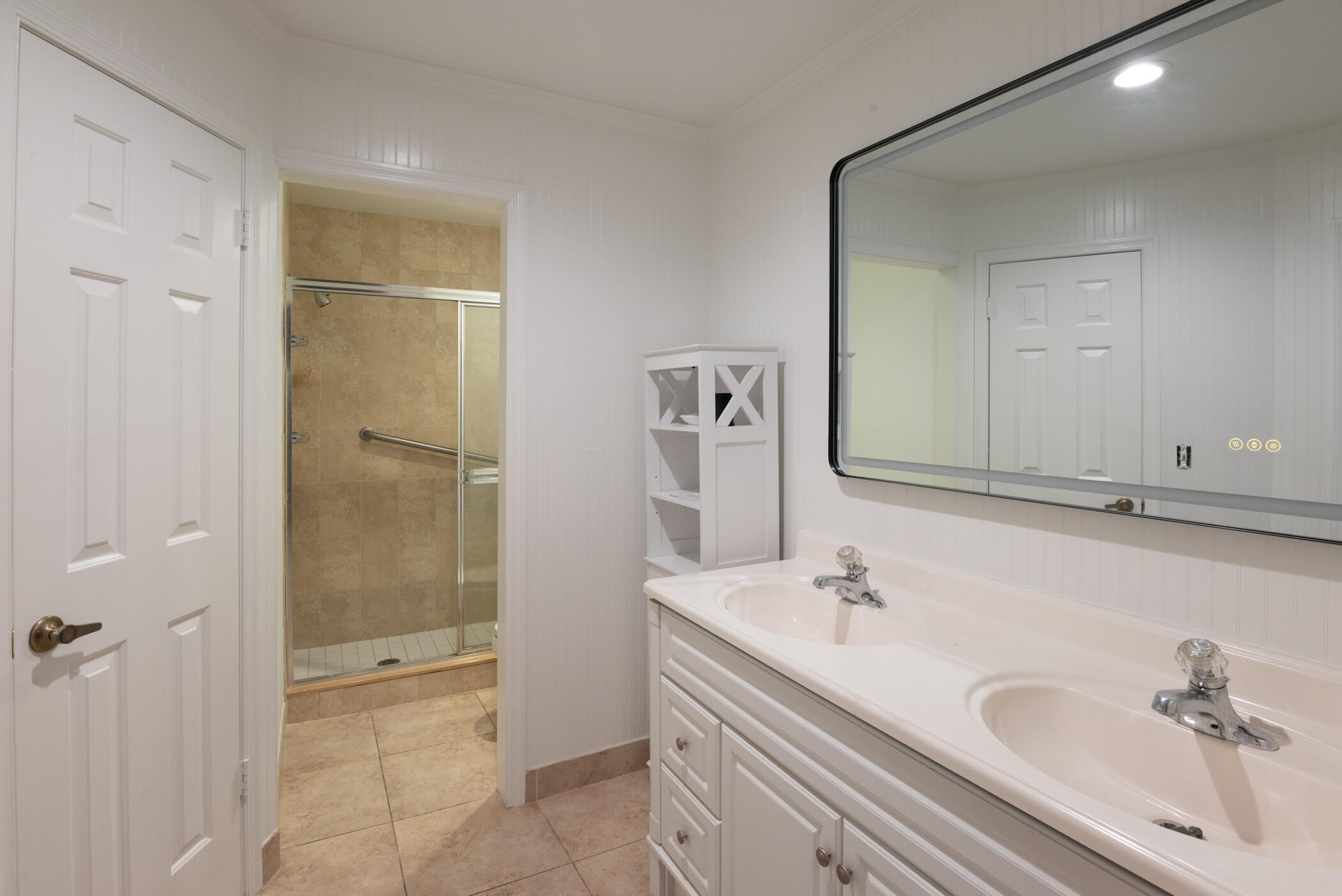 2918 Southeast Fairway West, Unit 13 Stuart, FL 34997 - Photo 22 of 34 a bathroom with a bathtub and a sink