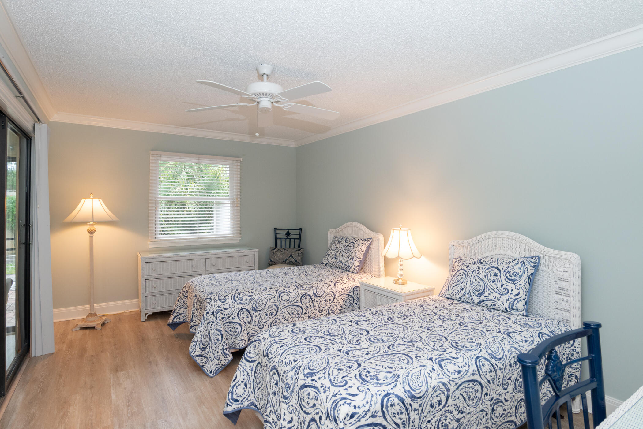 2918 Southeast Fairway West, Unit 13 Stuart, FL 34997 - Photo 24 of 34 a bedroom with a bed and a window