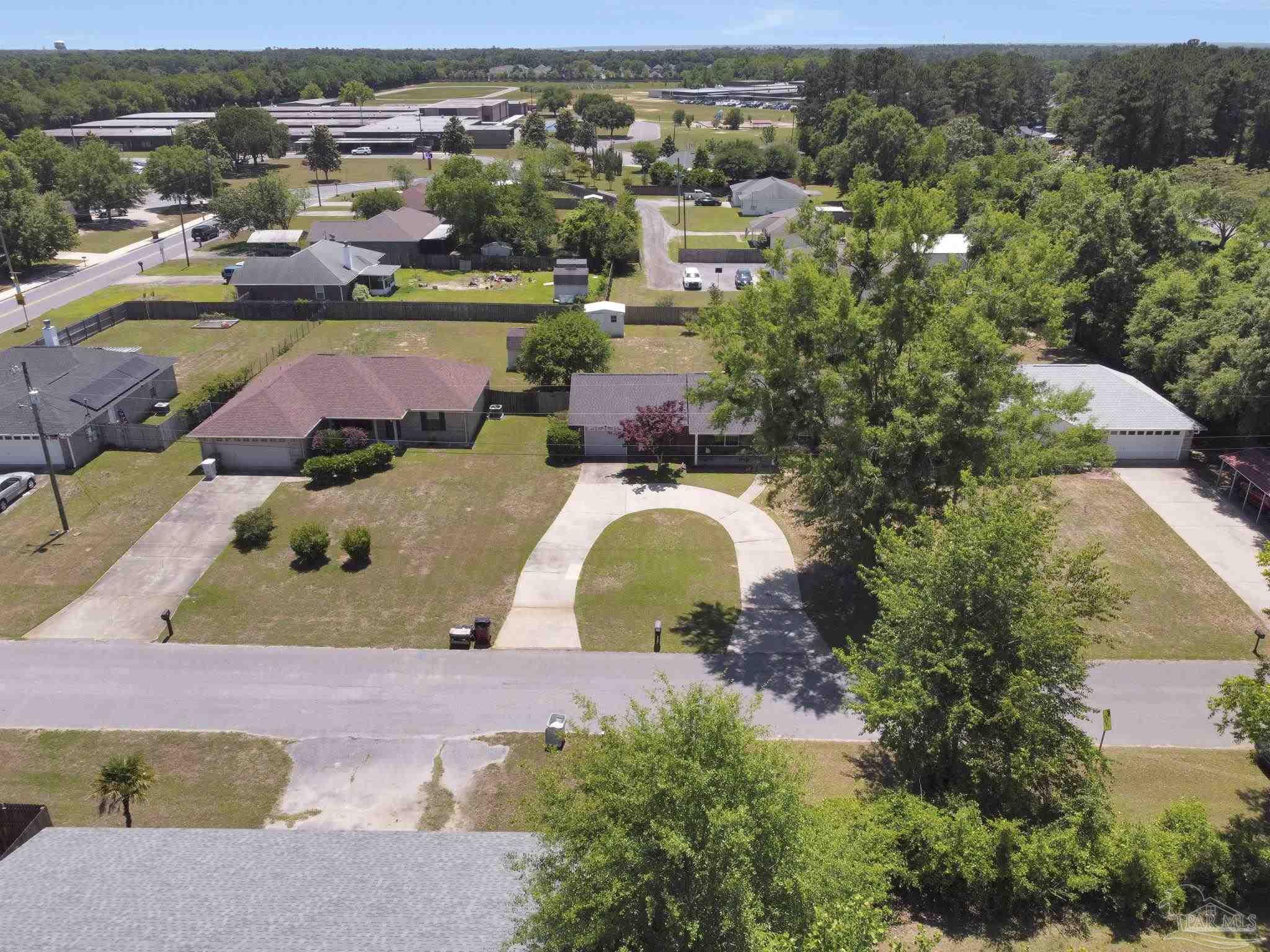 5539 Windrun Place Pace, FL 32571 - Photo 57 of 62 an aerial view of a house with yard swimming pool and outdoor seating