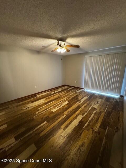 Undisclosed Address Cape Canaveral, FL 32920 - Photo 14 of 45 a view of a room with a ceiling fan and wooden floor