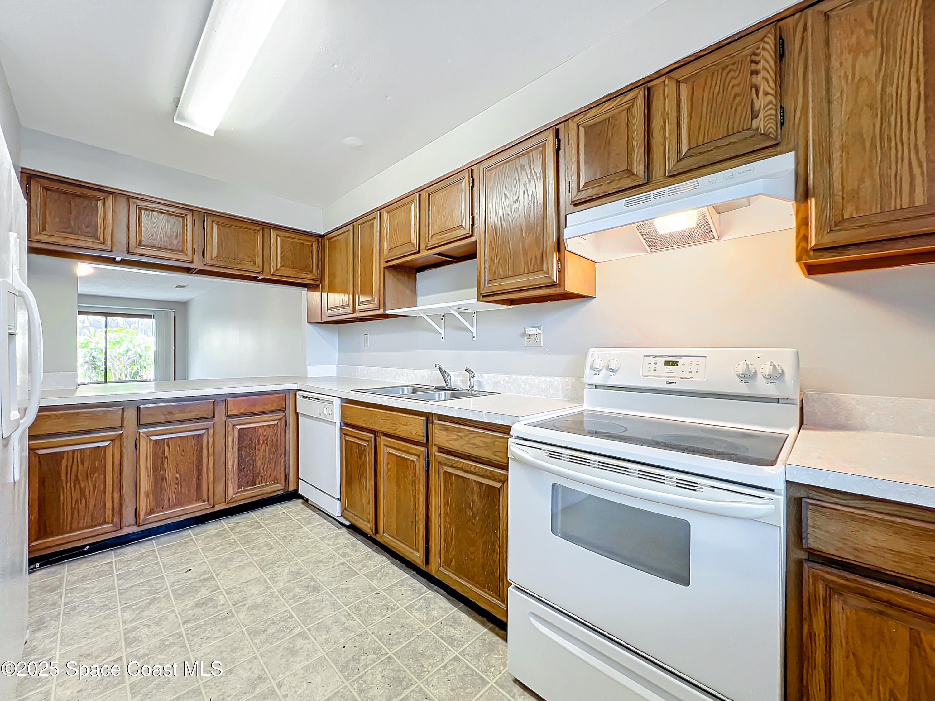 Undisclosed Address Cape Canaveral, FL 32920 - Photo 2 of 45 a kitchen with granite countertop cabinets stainless steel appliances and a sink