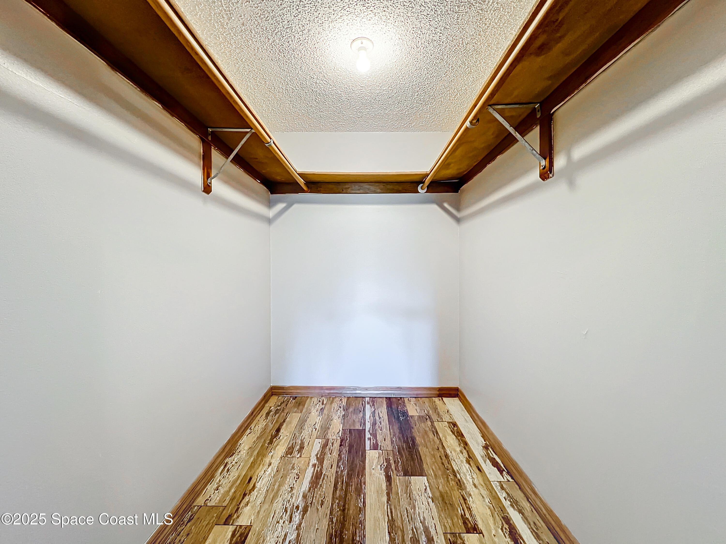 Undisclosed Address Cape Canaveral, FL 32920 - Photo 28 of 45 a view of a hallway with wooden floor