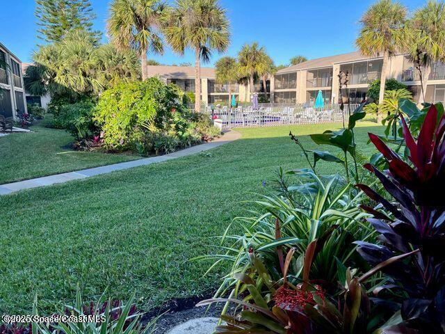 Undisclosed Address Cape Canaveral, FL 32920 - Photo 42 of 45 a view of a house with a yard and sitting area