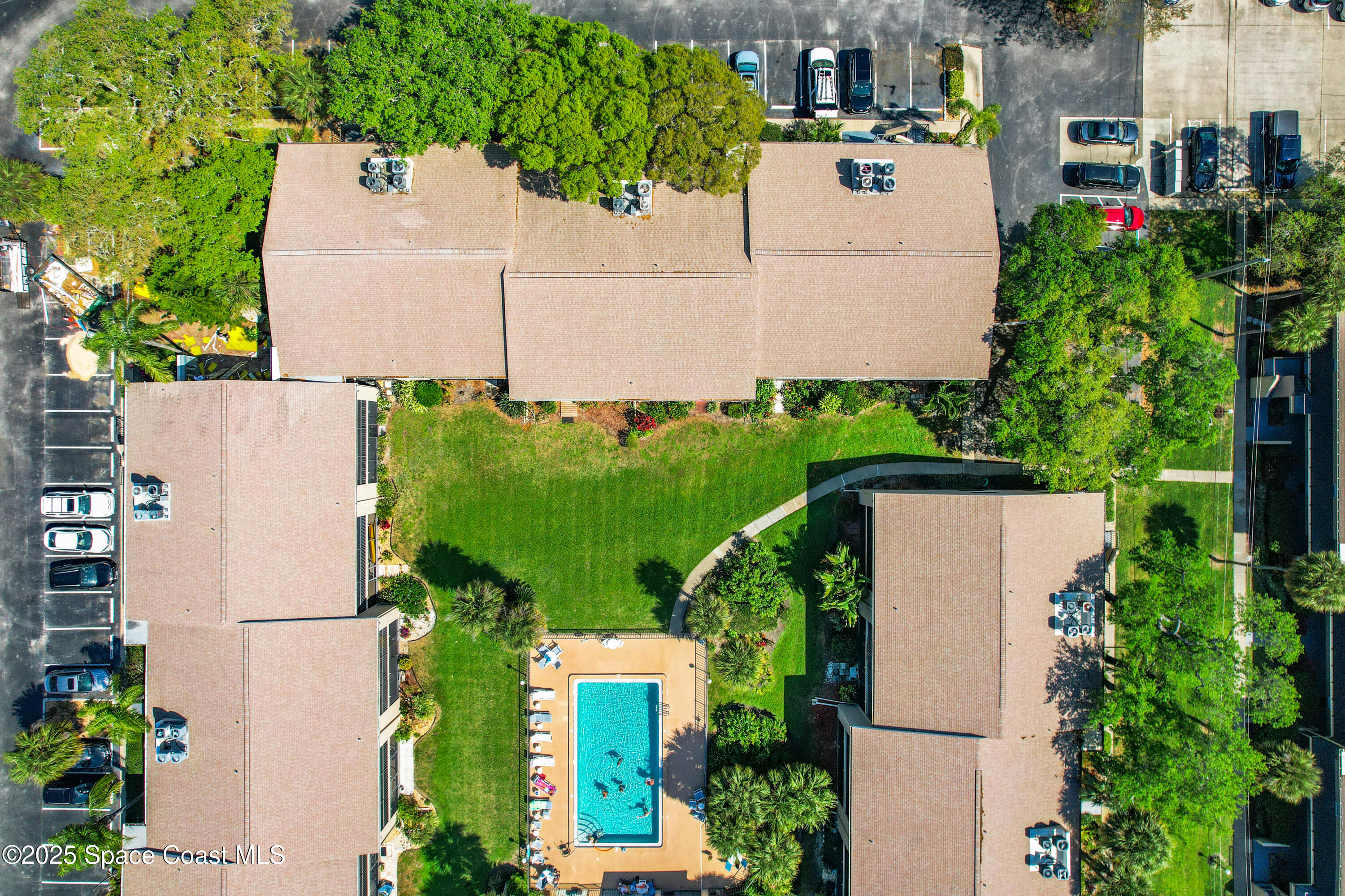 Undisclosed Address Cape Canaveral, FL 32920 - Photo 43 of 45 an aerial view of a house with a yard and garden