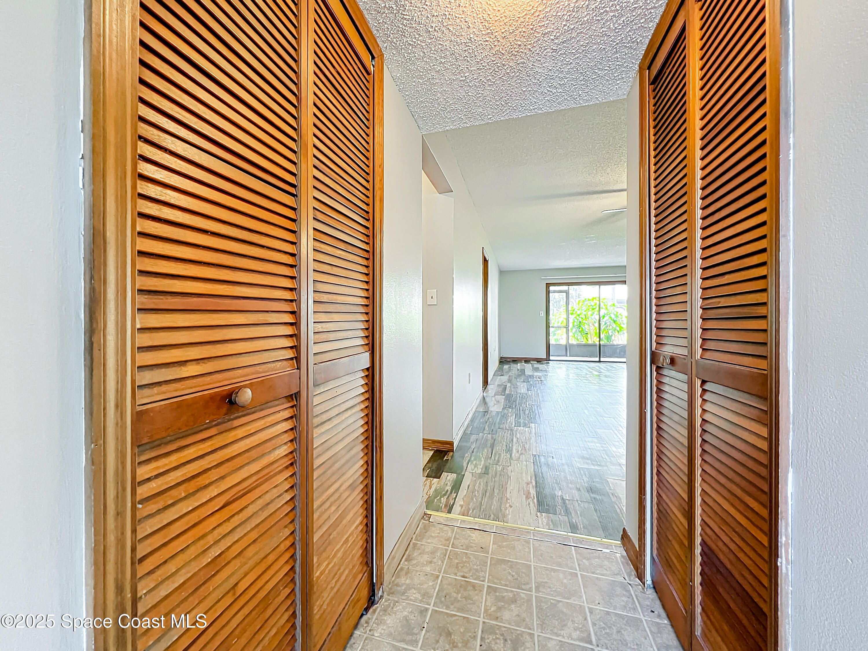Undisclosed Address Cape Canaveral, FL 32920 - Photo 7 of 45 a view of a hallway with wooden floor