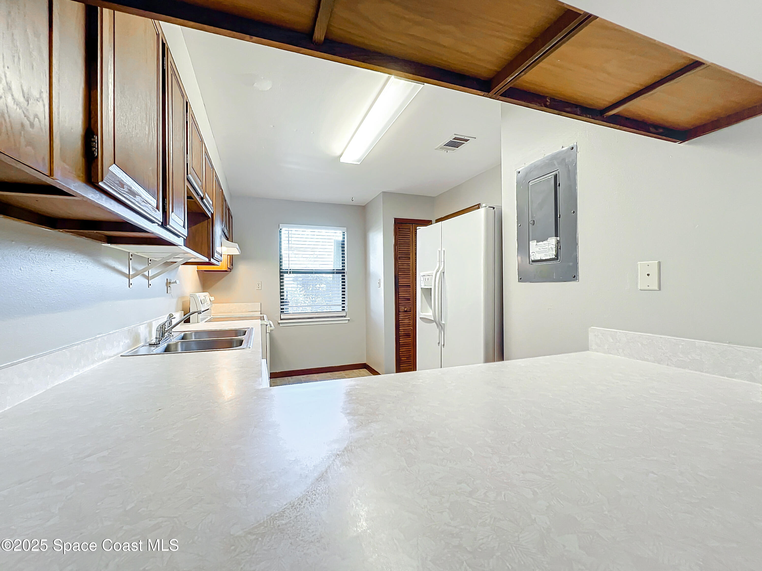 Undisclosed Address Cape Canaveral, FL 32920 - Photo 9 of 45 a view of a livingroom with wooden floor and stairs