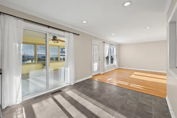 a view of an empty room with glass door